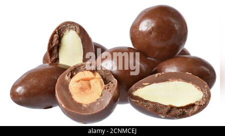 Chocolate balls with filling whole nuts hazelnuts and almonds close up isolated on a white background. Stock Photo