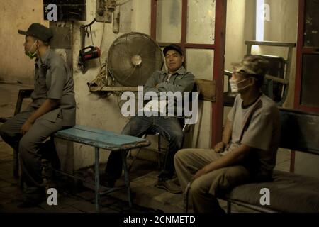 Workers having a break at Tasikmadu Sugar Mill in Karanganyar regency, Central Java province, Indonesia. Stock Photo