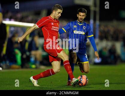 AFC Wimbledon's George Francomb (R) challenges Liverpool's Jordan Henderson during their FA Cup third round soccer match at Kingsmeadow Stadium in Kingston-upon-Thames, southern England January 5, 2015.       REUTERS/Stefan Wermuth (BRITAIN  - Tags: SPORT SOCCER)