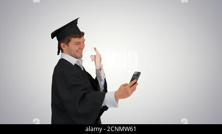 Graduate student taking selfie with different gestures on gradie Stock Photo