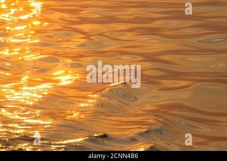 A sunset reflected on the sea off the coast of south Devon. England UK GB Stock Photo