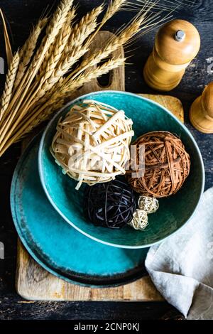 Rustic autumn table setting with ornamental balls Stock Photo