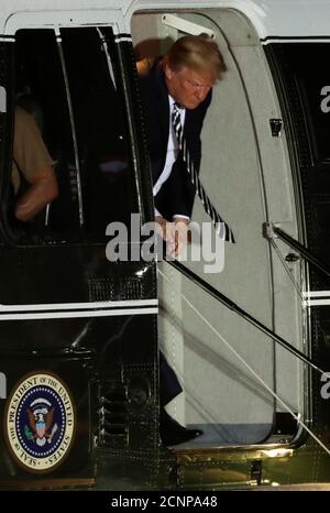 President Donald Trump arrives to greet the three Americans formerly held hostage in North Korea, at Joint Base Andrews, Maryland, U.S., May 10, 2018. REUTERS/Jim Bourg