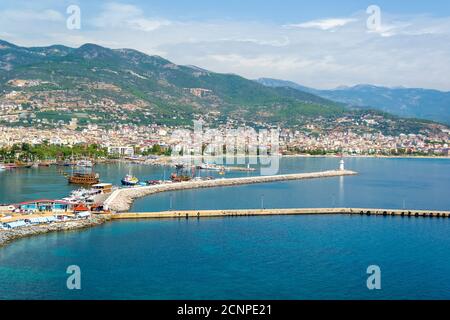 Cruise ships in Alanya harbor sea port and lighthouse, Turkey Stock Photo