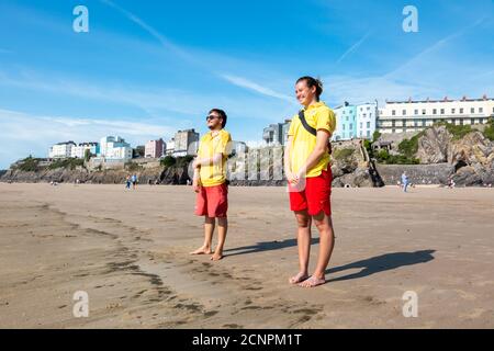 Lifeguards on Tenby beach, Pembrokeshire, Wales, UK Stock Photo