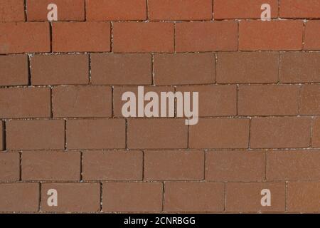 Top view on brown paving stone road. Old pavement of granite texture. Stock Photo