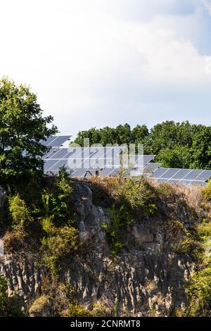 Large group of solar panels on the hill, photovoltaic power green environment energy supply Stock Photo