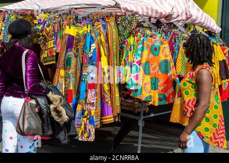 Colourful African prints on sale at a market stall in Brixton, London, England, United Kingdom, Europe Stock Photo