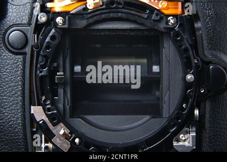 Repair SLR camera. Mirror inside camera, lens mount bayonet Stock Photo