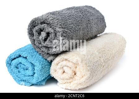 Stack of soft clean multi-colored spa towels on a white background Stock Photo