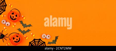Halloween Jack o Lantern pail with corner border of spilling candy ...
