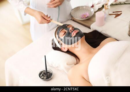 face care session at the spa center with a beautiful woman Stock Photo