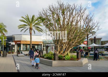 Outdoor Shopping Center with Upmarket Chain Retailers, a Movie