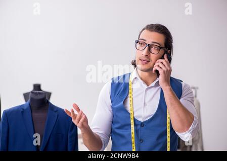 Young tailor working at workshop Stock Photo