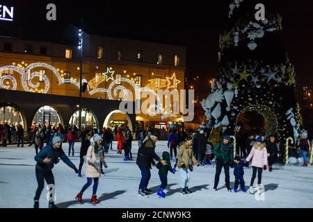 Ice skaters having fun in Kyiv, factory Roshen, Kyiv, UKRAINE - DECEMBER 08, 2019 Stock Photo