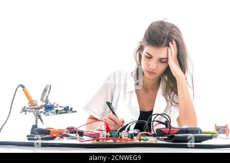 Woman Repairing Computer Part, Service Center, Electronics Repair Service Stock Photo