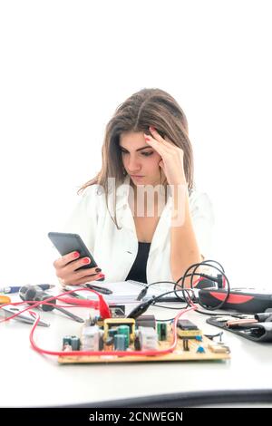 Woman Repairing Computer Part, Service Center, Electronics Repair Service Stock Photo