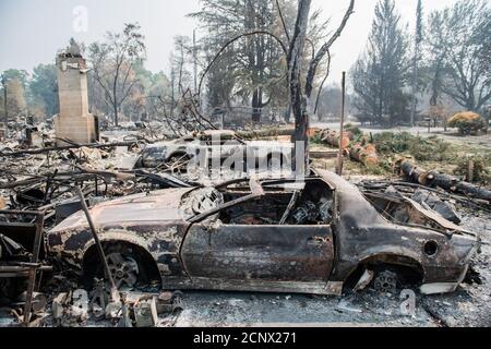 TALENT, ORE - SEPTEMBER 18, 2020: A general view of burned out vehicles amid the aftermath of the Almeda Fire. The town of Talent, Oregon, showing the burned out homes, cars and rubble left behind. In Talent, about 20 miles north of the California border, homes were charred beyond recognition. Across the western US, at least 87 wildfires are burning, according to the National Interagency Fire Center. They've torched more than 4.7 million acres -- more than six times the area of Rhode Island. Credit: Chris Tuite/imageSPACE