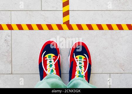 Sneakers, floor marking, from above Stock Photo