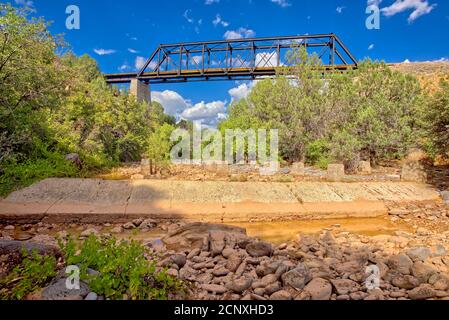 View from below an old railroad trestle bridge spanning Bear Canyon near Perkinsville Arizona in the Prescott National Forest. Stock Photo