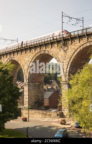 An LNER Hitachi Azuma train crosses the railway viaduct in Durham city, Co. Durham, England, UK Stock Photo