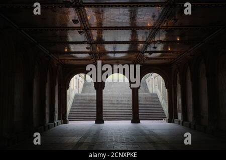 arched tunnel to the lower level of Bethesda Terrace in Central Park, NYC Stock Photo