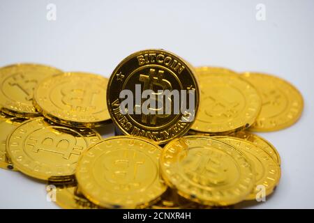 golden bitcoins coin on white background representing the electronic currency Stock Photo