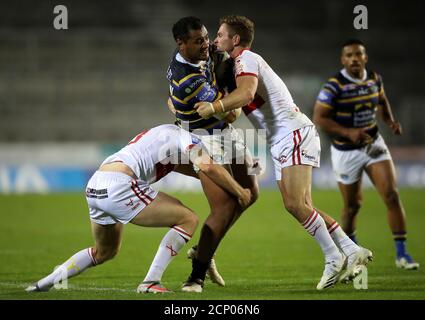 Leeds Rhinos Ava Seumanufagai (centre) is tackled by Hull KR's Matt Parcell (right) and Dean Hadley during the Betfred Super League match at Totally Wicked Stadium, St Helens. Stock Photo