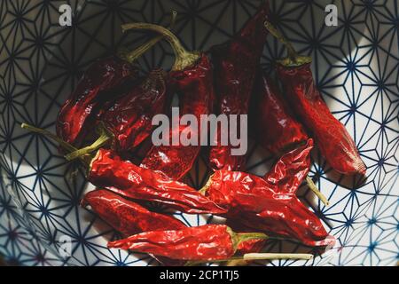 Mortara 09/15/2020: dried red chili peppers in a Japanese style bowl Stock Photo