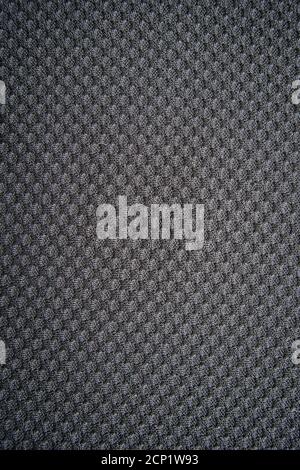 Close-up of pattern on a gray fabric. Dark dotted texture, background Stock Photo