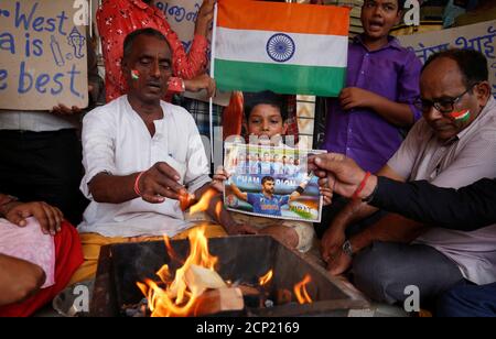 Fans offer special prayer for the victory of the Indian cricket team before the start of their one-day international match against Pakistan during the ICC world cup, inside a temple in Ahmedabad, India, June 16, 2019. REUTERS/Amit Dave