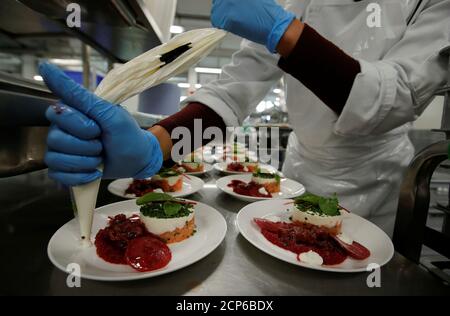 An Employee Of The Gate Gourmet Division Of Airline Caterer Gategroup Prepares Sweets At Their Facility At Zurich Airport In Kloten Switzerland March 26 18 Reuters Arnd Wiegmann Stock Photo Alamy