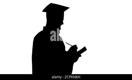 Thoughtful graduation man writing down his goals, Alpha Channel Stock Photo