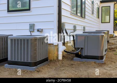 Air conditioning system unit installed outside facade of the new house Stock Photo