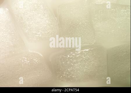 Wet melted gray ice cubes macro close up view background Stock Photo