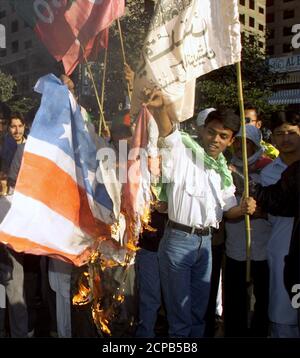 Pro-Iranian Shiite Muslims burn a U.S. flag during a rally in Karachi on December 22, 2000. The rally was organised to protest against Israeli occupation of Al-Aqsa mosque and to show solidarity with the people of Palestine. The protestors burned the flag because of the United State's support of Israel.  ZH/PB