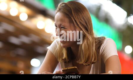 Woman texting on cellphone at night Stock Photo - Alamy