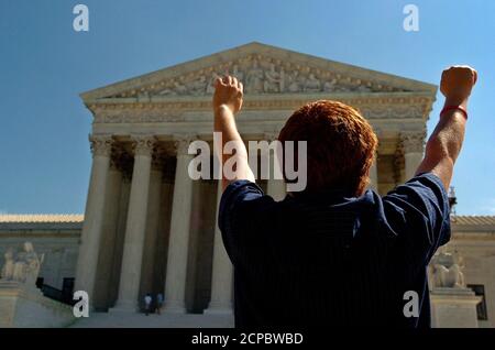 Member of an anti-abortion protest group stands in silent prayer in front of the US Supreme Court in Washington.  A member of an anti-abortion protest group, 'Bound for Life,' stands in silent prayer in front of the U.S. Supreme Court in Washington September 5, 2005. Earlier Monday, President George W. Bush nominated Judge John Roberts to become chief justice of the court. REUTERS/Jonathan Ernst