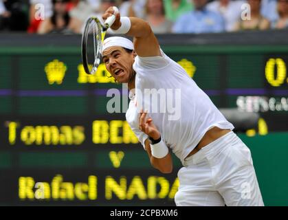 Spain's Rafael Nadal serves to Tomas Berdych of the Czech Republic during the men's singles final at the 2010 Wimbledon tennis championships in London, July 4, 2010.         REUTERS/Toby Melville (BRITAIN  - Tags: SPORT TENNIS)