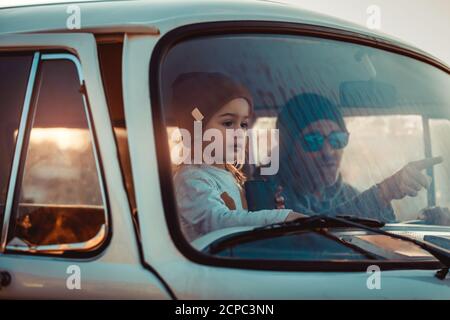 Father with his Little Baby Boy in the Car. Enjoying Road Trip Adventures. Active People. With Pleasure Spending Time Together. Happy Family Life. Stock Photo