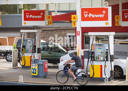 Shell fuel petrol station in Sydney,NSW,Australia cars on the forecourt filling up with fuel including V Power and diesel Stock Photo