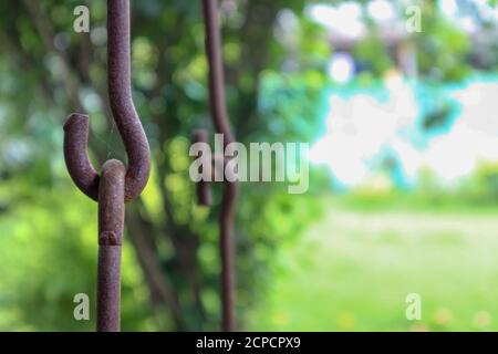 Rusty metallic chains holding together. Swing metal chain Links closeup. Stock Photo