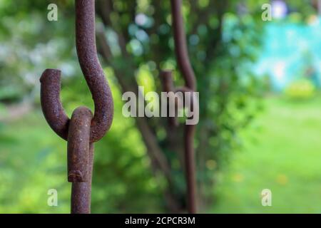 Rusty iron chains holding together. Swing metal chain Links closeup. Stock Photo