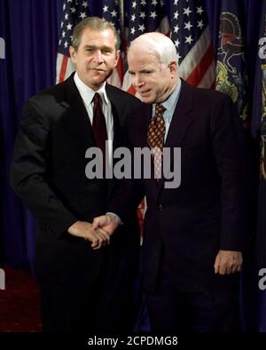 Republican presidential candidate Texas Gov. George W. Bush (L) and vanquished contender Sen. John McCain (R-AZ) shake hands following a press conference in Pittsburgh May 9. Senator McCain endorsed his former political rival Texas Gov. Bush as the Republican U.S. presidential nominee, but said he would not be Bush's running-mate.  WM/JP