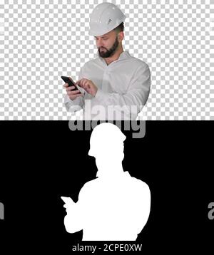 Smart engineer in white shirt and safety engineering hat using s Stock Photo