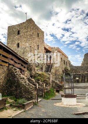 SZIGLIGET, HUNGARY - 08/26/2020: Medieval castle ruins of Szigliget. Blue sky with clouds on background. Stock Photo