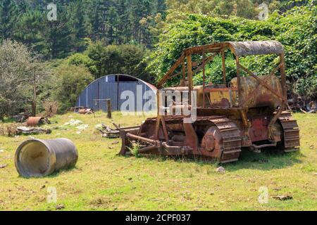 An old, rusty bulldozer, abandoned on a farm Stock Photo