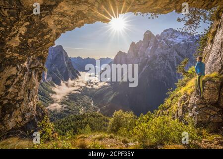 Italy, Veneto, Belluno, Agordino. Lookout from the legendary San Lucano cave on the valley, Pale dei Balconi, Dolomites Stock Photo