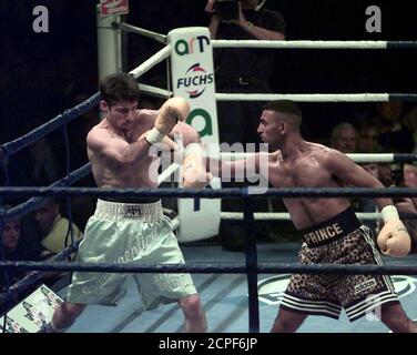 Prince Naseem Hamed (R) throws a punch at Argentinian Juan Carbera during their WBO and IBF featherweight championship fight July Hamed retained his titles after the referee stopped fight