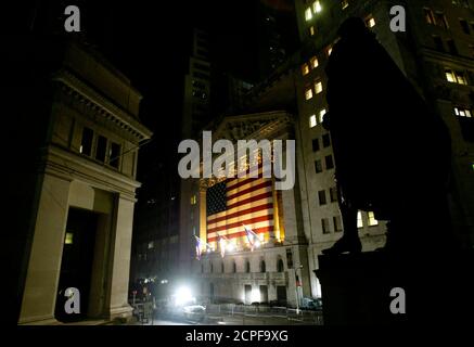 Emergency lights illuminate the front of the New York Stock Exchange in New York early on August 15, 2003 after a blackout hit the city. The blackout stranded thousands of commuters, trapped subway riders underground and evoked fearful memories of the Sept. 11 attacks. City and federal officials moved quickly to assure the public that sabotage was not to blame. 'There is no evidence whatsoever of terrorism,' said Mayor Michael Bloomberg. REUTERS/Peter Morgan  PM